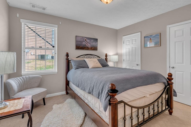 bedroom featuring light colored carpet