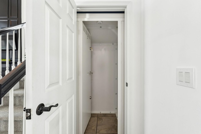 corridor with tile patterned floors