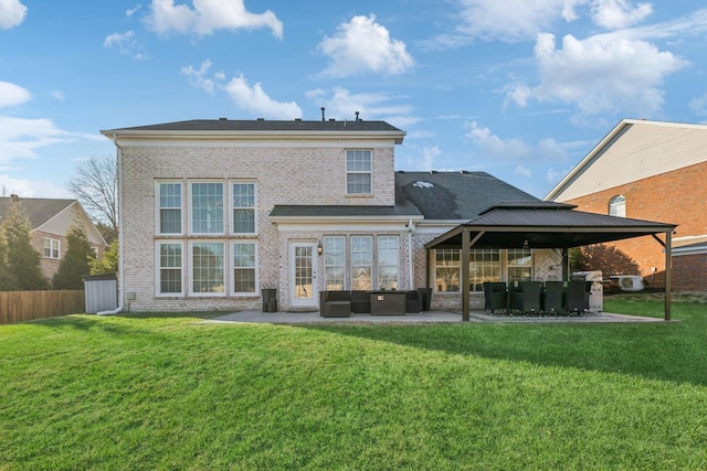 rear view of property with a yard, an outdoor hangout area, and a patio