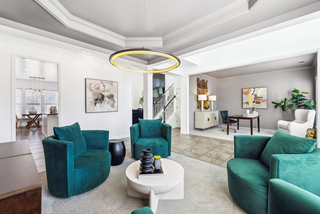 tiled living room featuring a notable chandelier, a raised ceiling, and ornamental molding