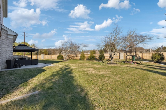 view of yard with a playground, a patio area, and a gazebo