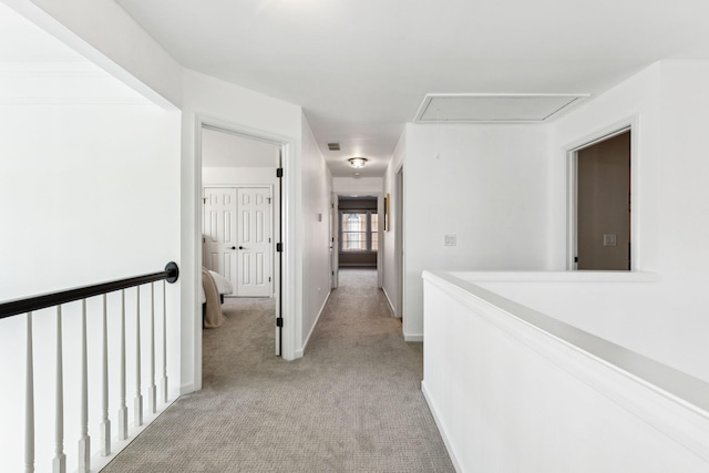 hallway with light carpet