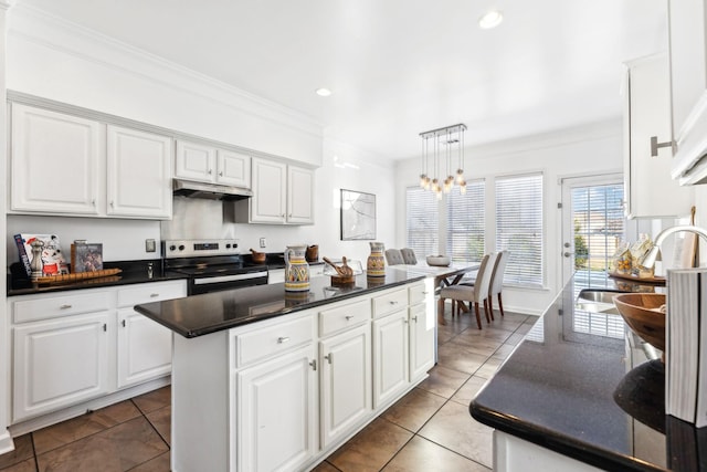 kitchen featuring a kitchen island, white cabinetry, and stainless steel range with electric stovetop