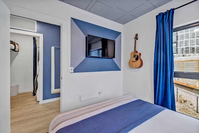 bedroom with light hardwood / wood-style flooring