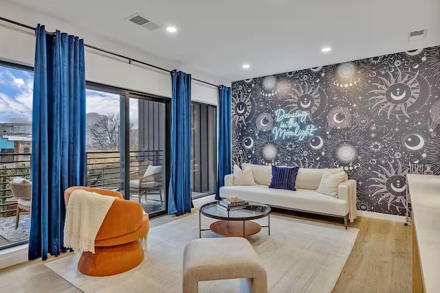 living room with light hardwood / wood-style flooring