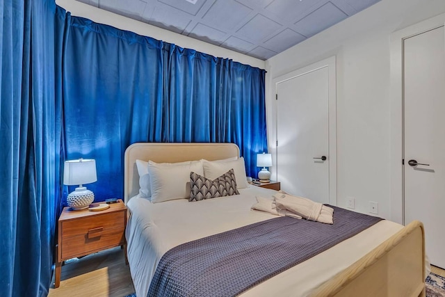 bedroom with wood-type flooring