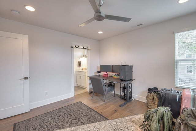 office area featuring light wood-type flooring and ceiling fan