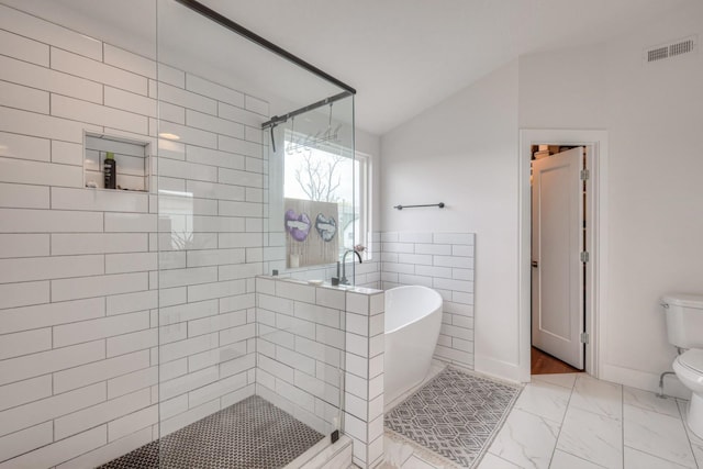 bathroom featuring toilet and shower with separate bathtub