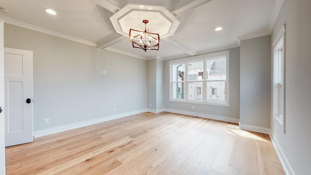 empty room with light hardwood / wood-style flooring, beamed ceiling, ornamental molding, and an inviting chandelier