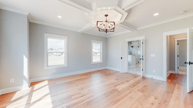 unfurnished room featuring coffered ceiling, ornamental molding, light hardwood / wood-style floors, and an inviting chandelier