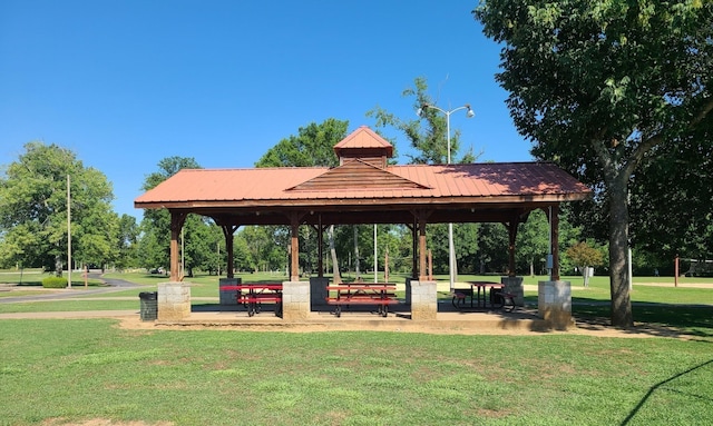 view of property's community featuring a gazebo and a lawn