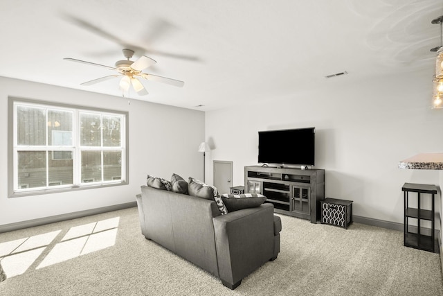 living room featuring ceiling fan and light carpet