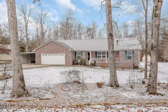 ranch-style home with covered porch and a garage