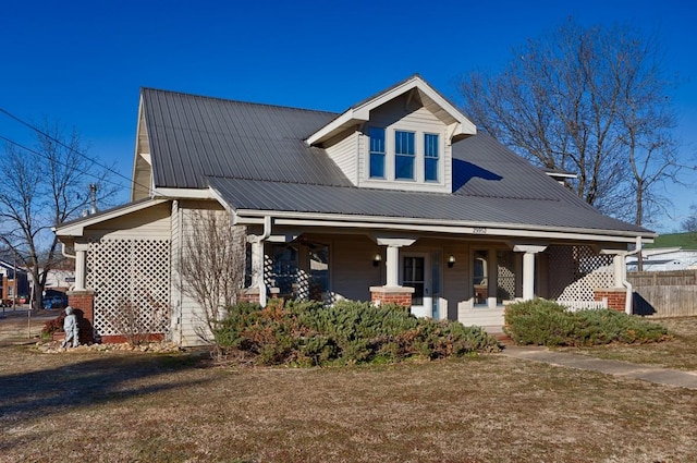 view of front of property with a front lawn and a porch