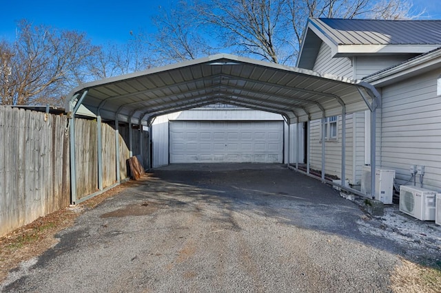 garage featuring ac unit and a carport