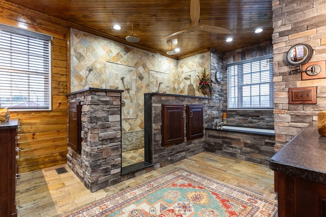 bar featuring dark brown cabinetry, light hardwood / wood-style flooring, wooden ceiling, and ceiling fan