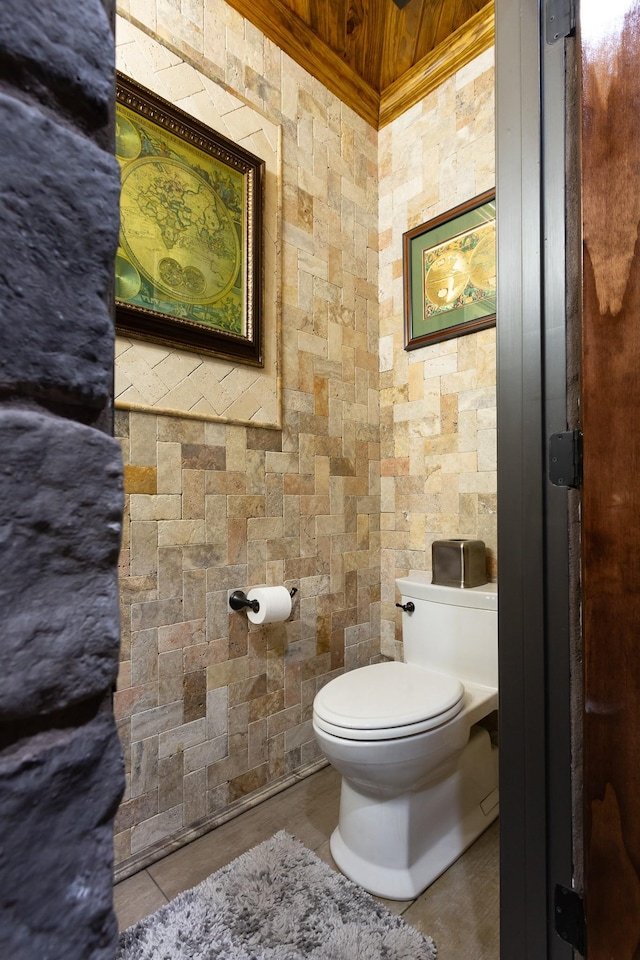 bathroom featuring tile patterned flooring and toilet