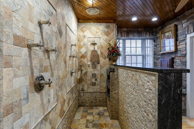 bathroom with wooden ceiling and tiled shower