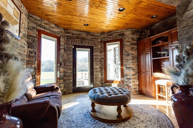 living area featuring wooden ceiling