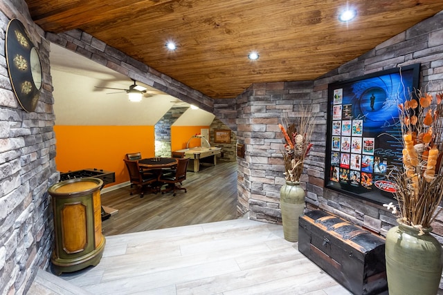 interior space featuring ceiling fan, lofted ceiling, wooden ceiling, and light hardwood / wood-style floors