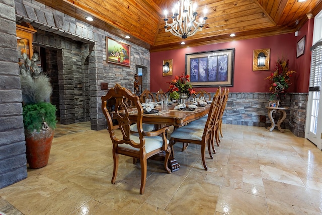 dining room featuring a notable chandelier, vaulted ceiling, and wooden ceiling