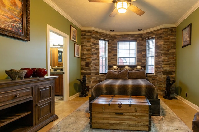 bedroom with ornamental molding, connected bathroom, and ceiling fan