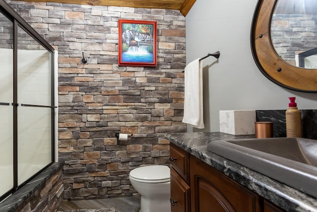 bathroom featuring vanity, hardwood / wood-style floors, and toilet