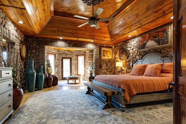 bedroom with lofted ceiling, wooden ceiling, and carpet