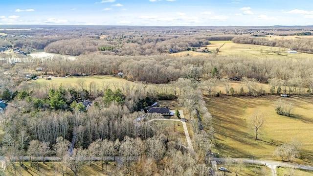 birds eye view of property featuring a rural view