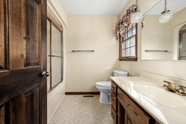 full bathroom featuring toilet, enclosed tub / shower combo, and vanity