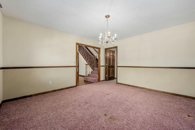 unfurnished room featuring carpet floors and a notable chandelier