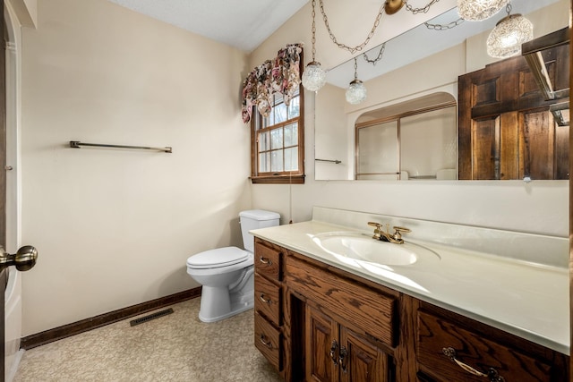 bathroom with toilet and vanity