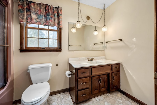 bathroom featuring toilet and vanity