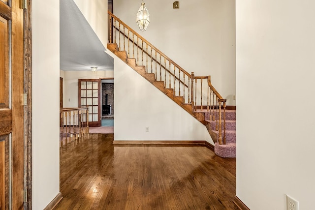 staircase featuring hardwood / wood-style flooring