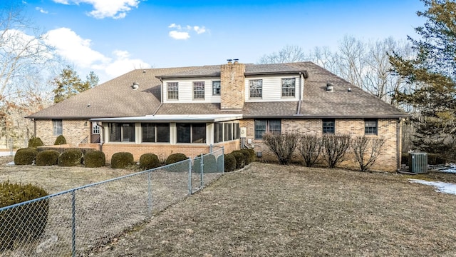 back of property with cooling unit and a sunroom