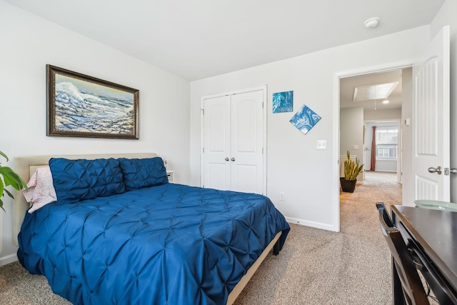 carpeted bedroom with a closet