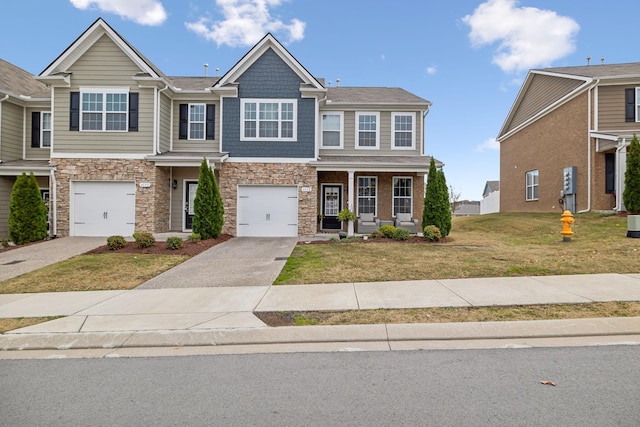 view of front of home featuring a front yard and a garage