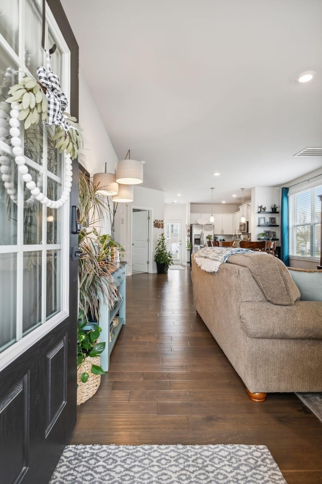 living room with dark hardwood / wood-style flooring