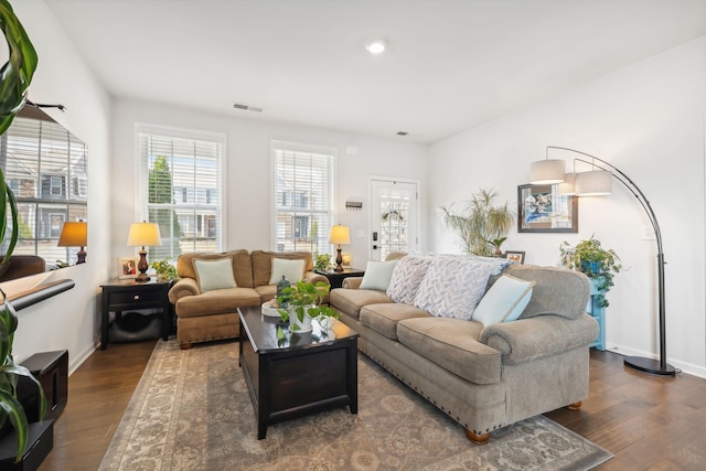 living room featuring dark hardwood / wood-style floors