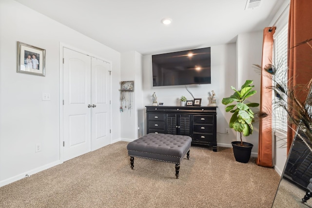 living area featuring carpet flooring