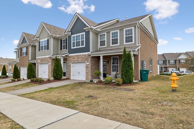 view of front of property with a garage and a front lawn