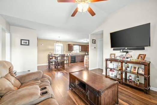 living room featuring ceiling fan, hardwood / wood-style floors, and lofted ceiling