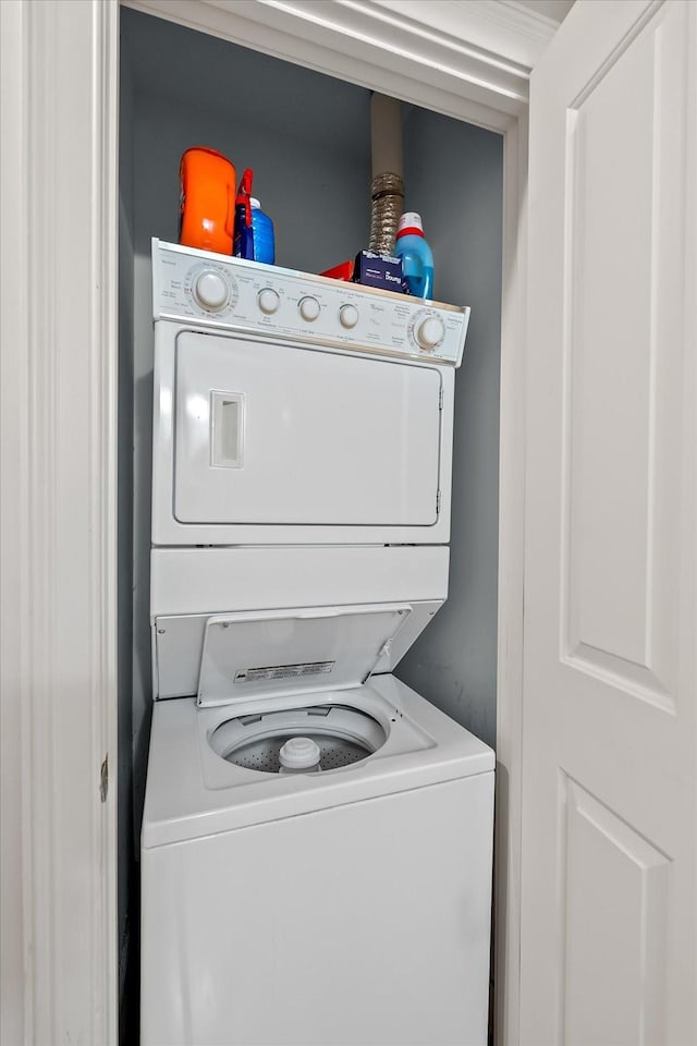 washroom with stacked washer and dryer