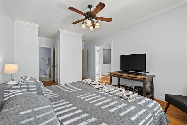 bedroom featuring crown molding, wood-type flooring, connected bathroom, and ceiling fan