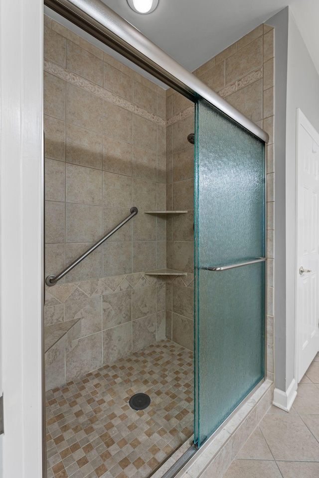 bathroom featuring tile patterned floors and walk in shower