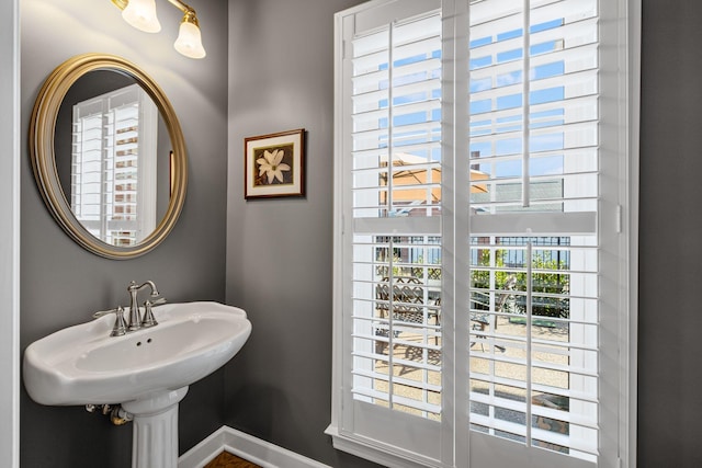 bathroom with sink and a healthy amount of sunlight