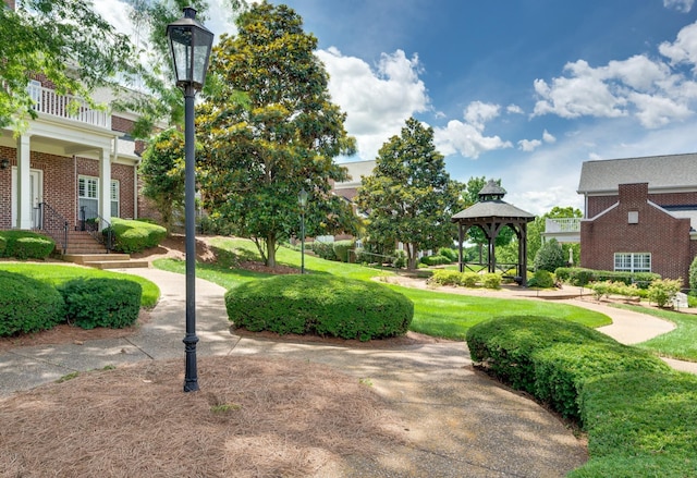 view of community with a gazebo and a lawn