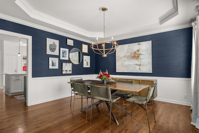 dining room featuring a notable chandelier, crown molding, and dark wood-type flooring