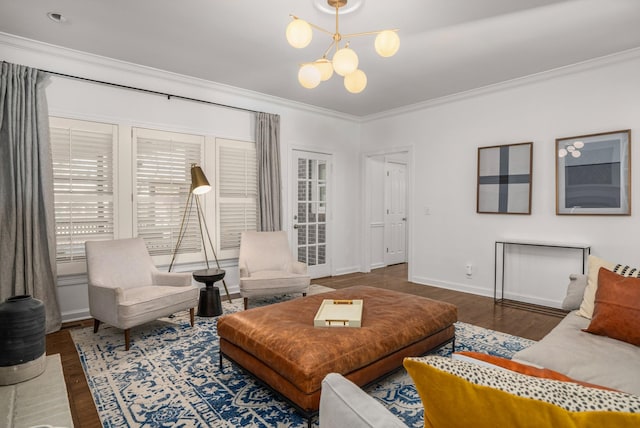 living room with dark hardwood / wood-style flooring, crown molding, and a notable chandelier