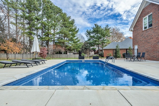 view of swimming pool featuring a patio